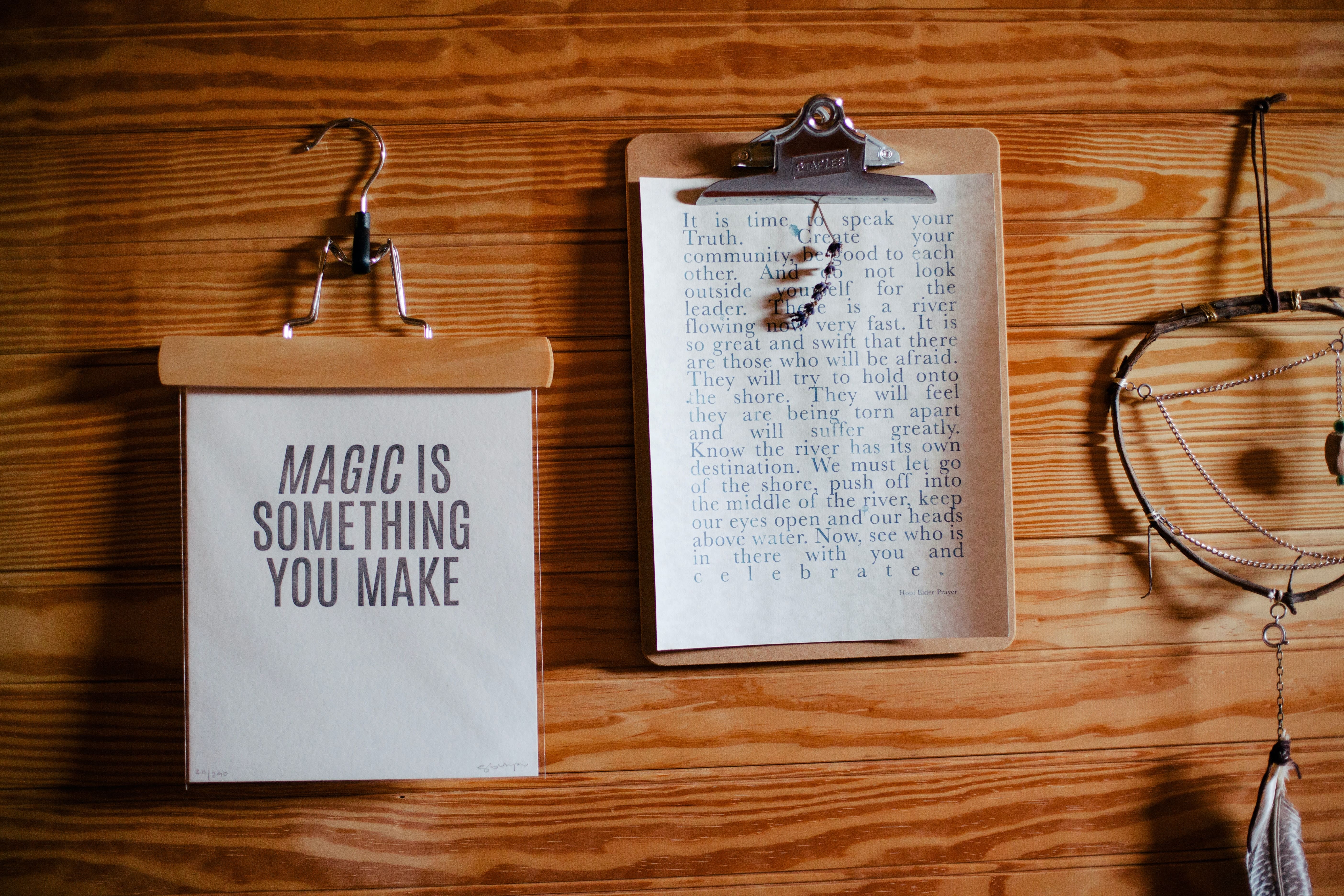 two writing pads, one with the words magic is something you make and the other a longer message
