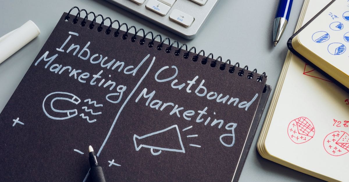 inbound marketing vs outbound marketing written as a comparison on a black surface