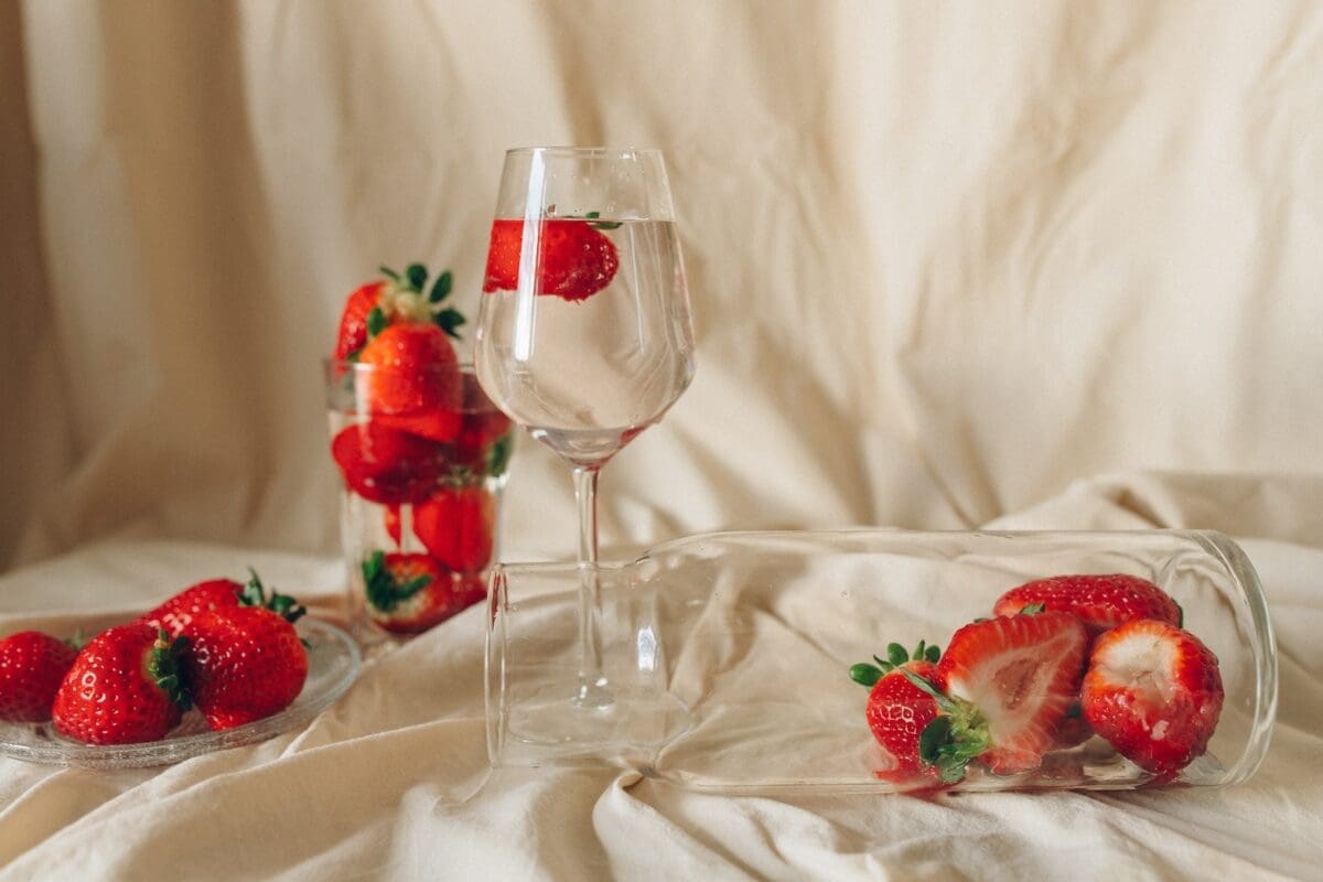 Red Strawberries in Clear Wine Glass. The red strawberries are often a symbol of the deep emotional intimacy of lovers