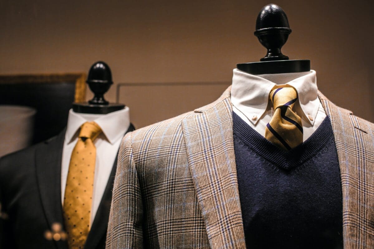 blazers, ties, sweaters on a clothes rack. The ruler likes to dress powerfully