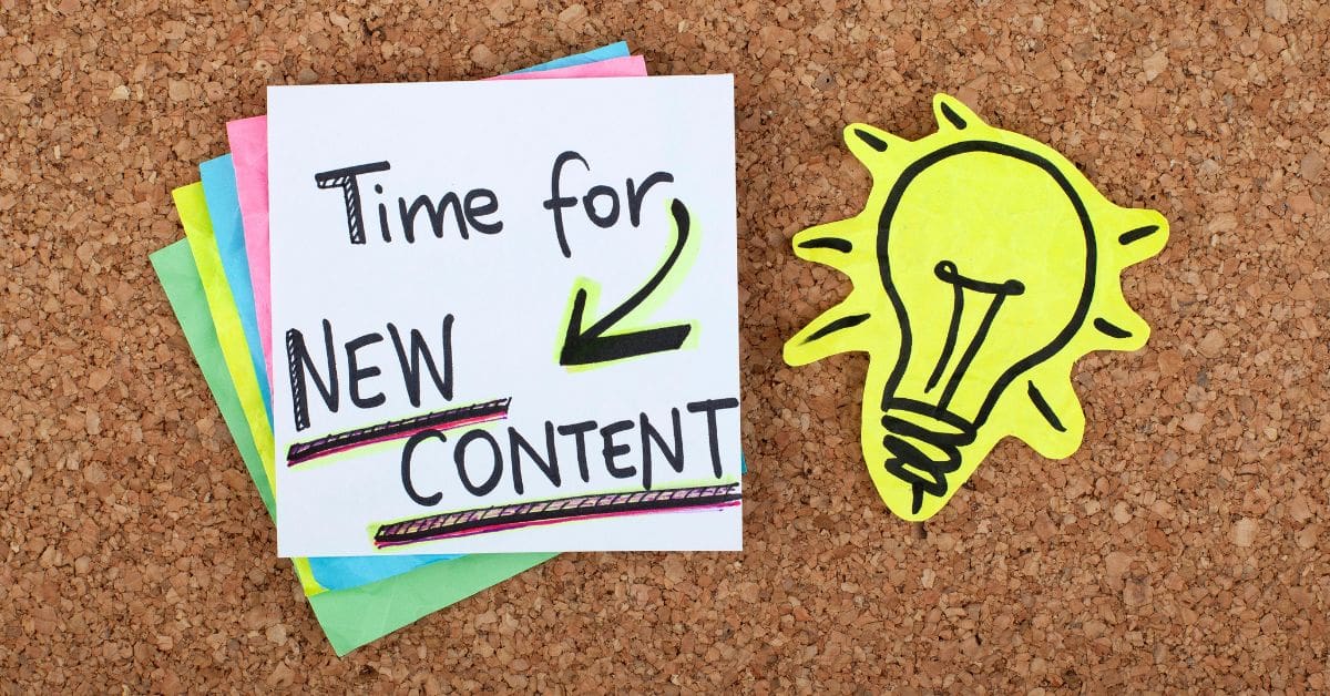 a pin board with a bulb stuck to it and post its with 'time for new content' written on it